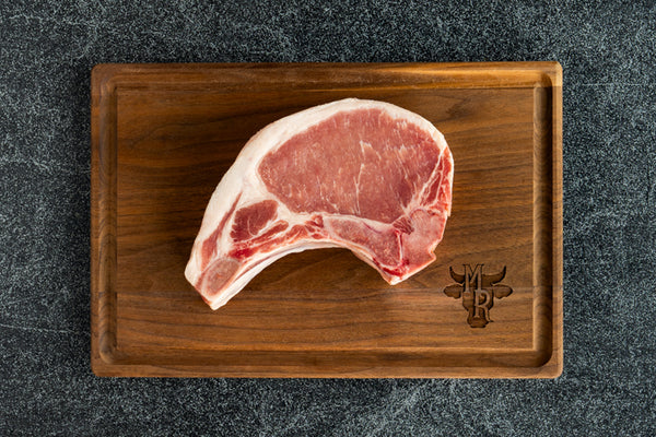 Top view of a Marble Ridge Farms Bone-in Center Cut Pork Chop